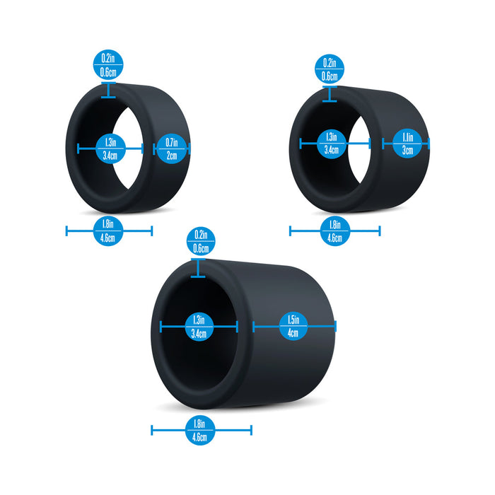 The Accelerate Thick Stretchy Black Silicone Cock Rings - Set of 3 are shown as black cylindrical rings with blue labels displaying width, height, and depth in inches and centimeters, clearly marking diameter and thickness for size selection.