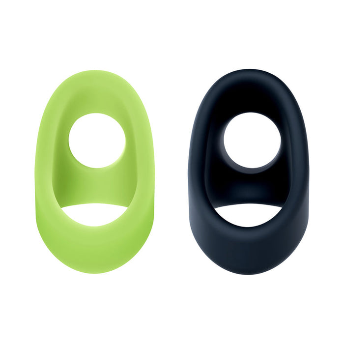 The Flare Cock Slings for Erection Support - Set of 2 includes a green glow-in-the-dark cock ring and a black stamina support sling, both ultra-stretchy silicone with oval shapes and center openings, shown side by side on white.