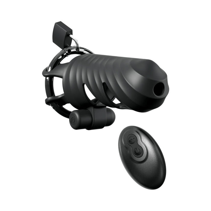 The Cock Blocker Remote-Controlled Vibrating Cock Cage, in black with ribbed detail and integrated lock, is shown next to its small oval remote with two buttons, all set against a white background.