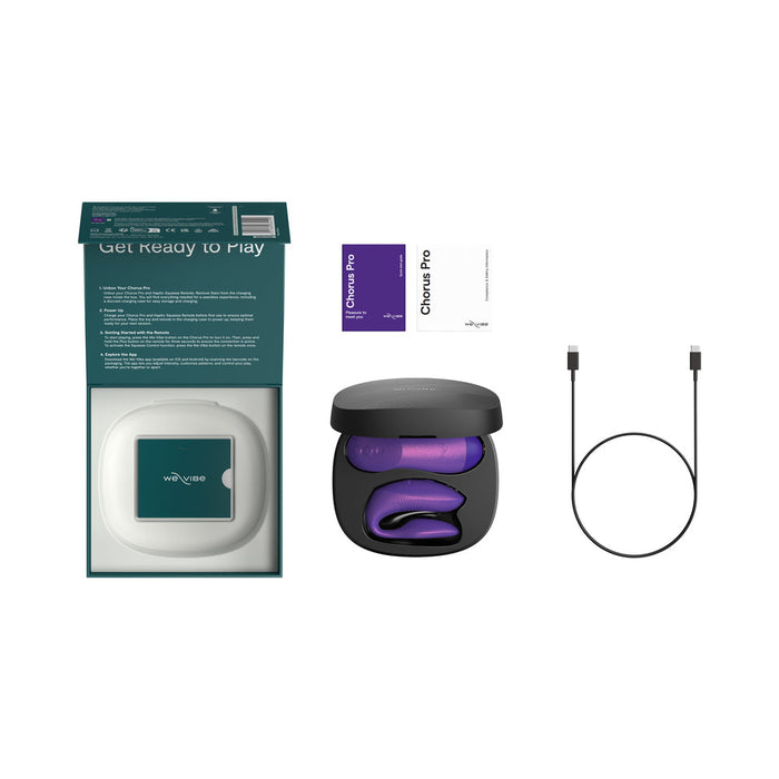 A teal box, open black charging case with the purple We-Vibe Chorus Pro Wearable Couples' Vibrator (triple motors & remote), two instruction cards, and a black USB charging cable are arranged on a white background.