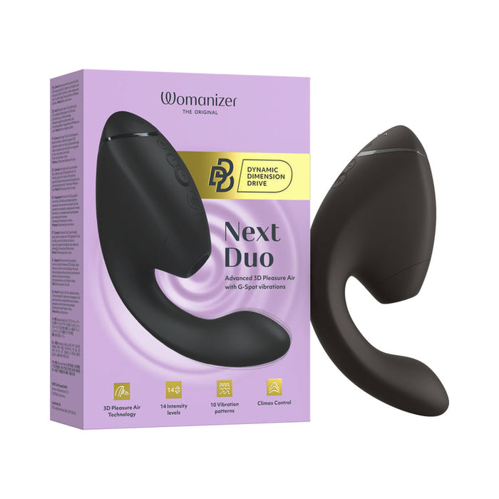 The Womanizer Next Duo Pleasure Air + Vibration Blended Orgasm Stimulator in black is shown next to its purple and yellow box. It features a curved design, side buttons, and combines 3D Pleasure Air technology with vibration for blended orgasms.