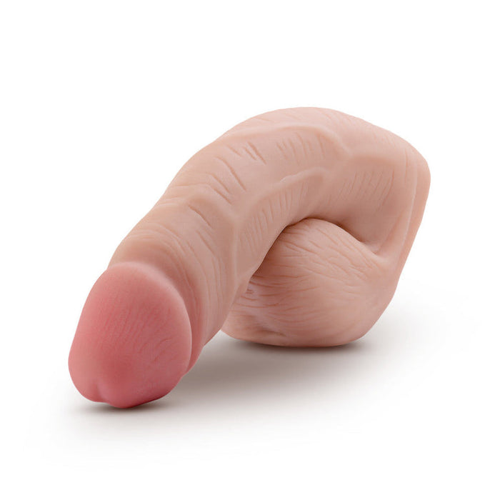 The URSELF 5 Inch Vanilla Silicone Packer Dildo is made from body-safe platinum-cured silicone with a curved end, making it a discreet and comfortable packing underwear accessory.
