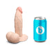 The b-Vibe Slipskin Realistic 6 Inch Girthy Silicone Dildo in Vanilla stands upright beside a blue can with a white "b" logo, both set against a plain white background.