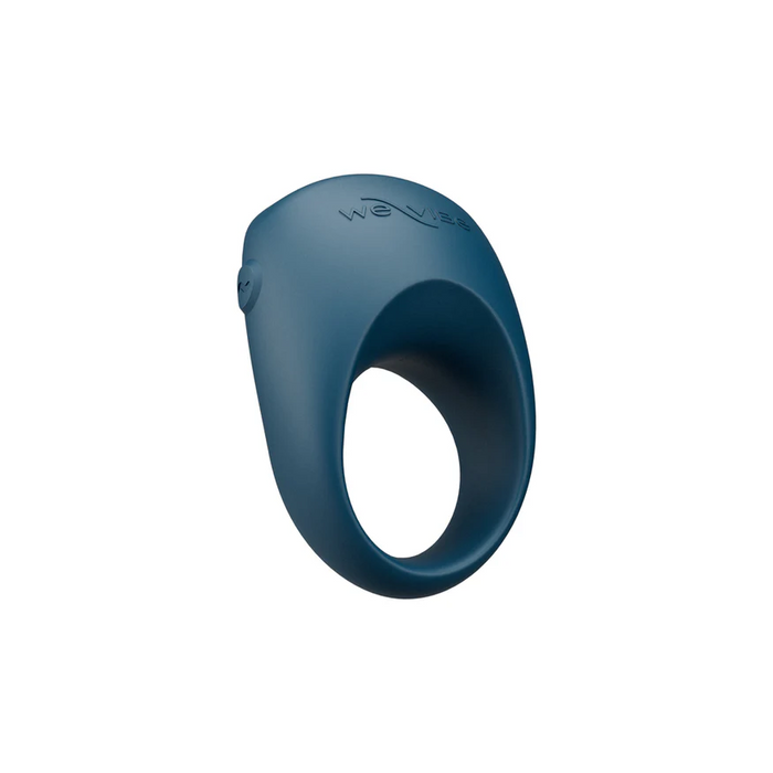 The We-Vibe Pivot 2 Vibrating Silicone Rechargeable Penis Ring, in blue, features a rounded raised top and side button for hands-free clitoral stimulation. "We-Vibe" is embossed on the top.