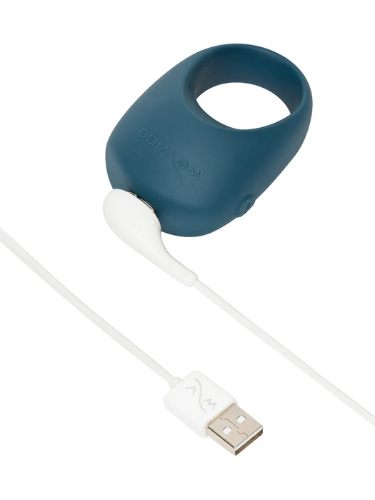 The We-Vibe Pivot 2 is a blue silicone rechargeable vibrating penis ring with a white USB magnetic charging cable, perfect for couples seeking to enhance intimacy.