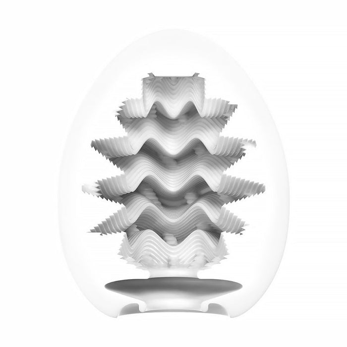 A white, egg-shaped Tenga Egg Standard 3 Pack Disposable Masturbators I is cut in half to reveal its intricate, wavy internal sleeve with spikes and ridges for textured male pleasure. The background is plain white.