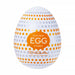 A white Tenga Egg with orange and gray star patterns, labeled "EASY BEAT EGG STARRY" and "TENGA LIVE WITH WONDER," is part of the Tenga Egg Standard 3 Pack Disposable Masturbators I and features a textured sleeve for enhanced sensation.