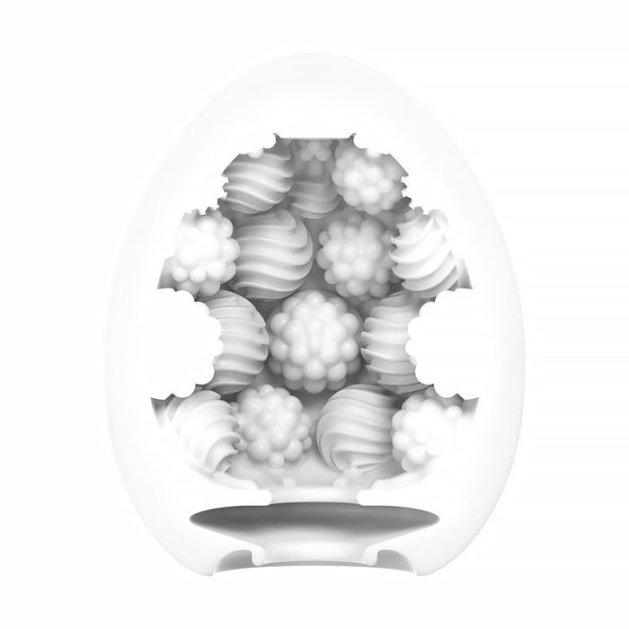 The Tenga Egg Standard 3 Pack Disposable Masturbators II features white, egg-shaped sleeves with open sections, revealing textured interiors in whip and berry patterns. The product is shown against a plain white background.