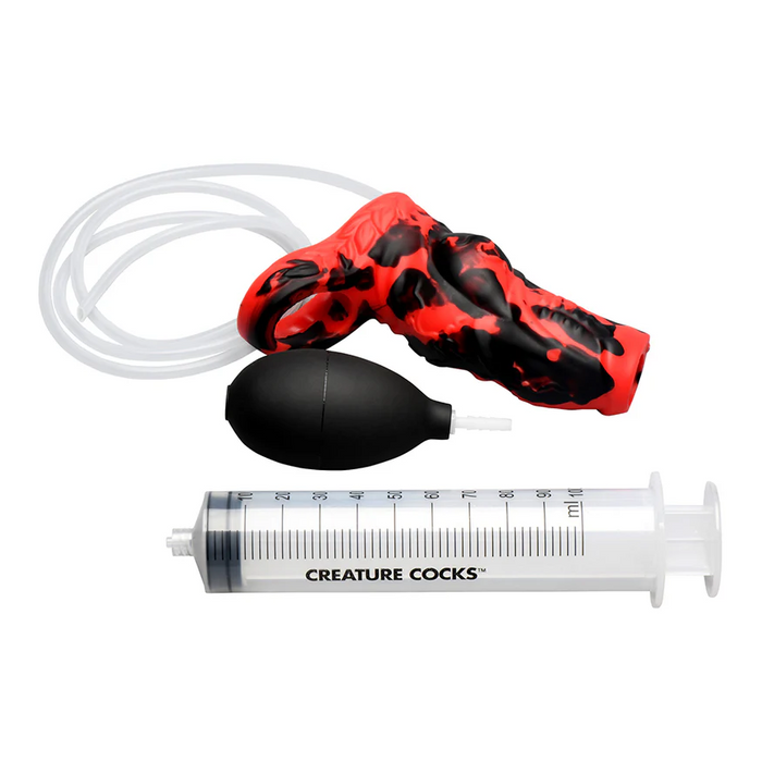 The Hell Hound Canine Squirting Penis Enhancer is a red and black marbled silicone fantasy toy featuring an attached clear tube, black squeeze bulb, and large clear syringe labeled "CREATURE COCKS®.
