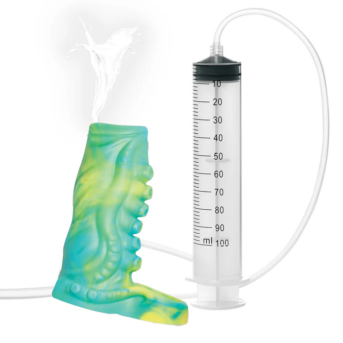 The Siphon Green Tentacle Squirting Penis Enhancer features a colorful silicone tentacle sleeve attached to a clear plastic syringe and tube, shown squirting liquid from its tip.
