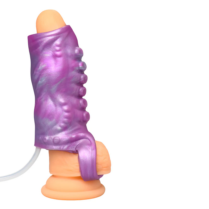 The Siphon Tentacle Squirting Purple Penis Enhancer features a flesh-toned, realistic dildo partially covered by a textured purple and blue squirting sleeve with a wired attachment, displayed against a white background.