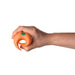 A hand holding the Emojibator Peach Vibrating Penis Stroker, an orange, spiral-shaped waterproof sex toy with a green button, against a white background.