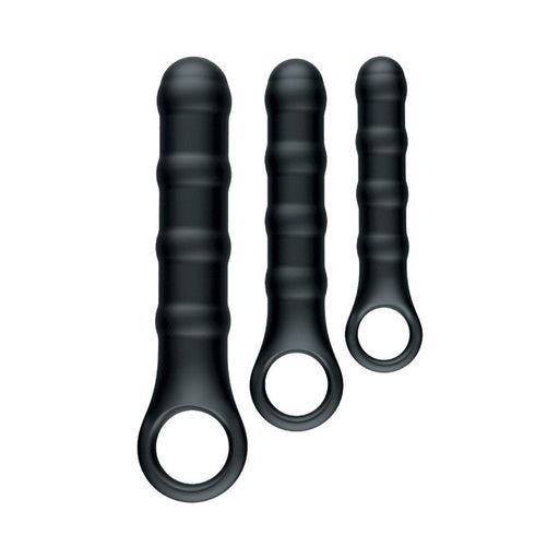 The Ass-Sation Silicone Anal Wand Training Kit includes three black silicone finger sleeves with ribbed shafts and circular openings in small, medium, and large sizes—ideal for beginner anal play or progressive training—shown on a white background.