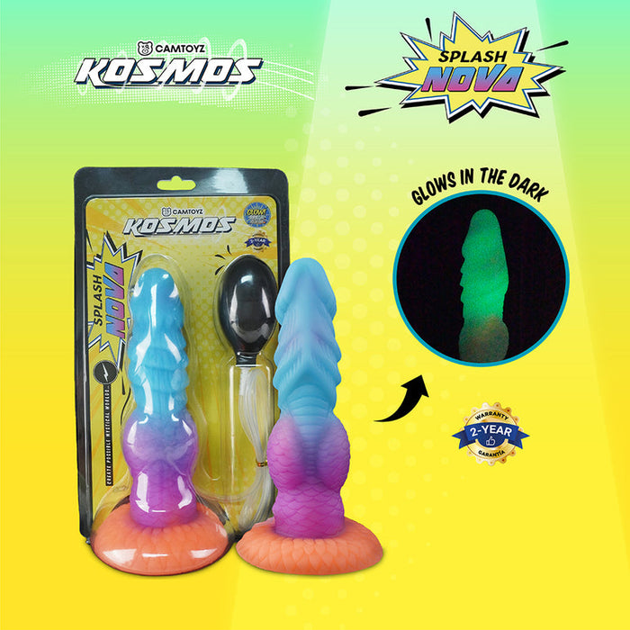 The Splash Nova Squirting 10 Inch Glow in the Dark Creature Dildo is a colorful silicone sex toy with an orange base, packaged with a black spoon. The box highlights its glow-in-the-dark feature and includes a 2-year warranty on a green-yellow background.