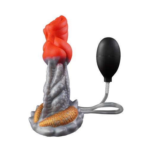 The Splash Garon Squirting 7.5 Inch Dragon Creature Dildo, shown in red, gray, and gold silicone with a black hand pump for inflation, adds a creative fantasy element to pleasure on a classic white backdrop.