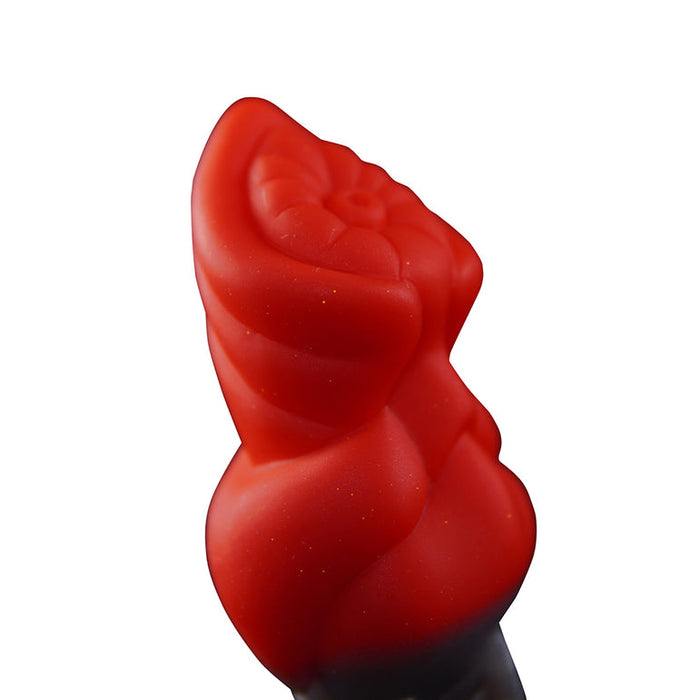 A close-up of the Splash Garon Squirting 7.5 Inch Dragon Creature Dildo, a red fantasy toy with a twisted, textured design, shown against a white background.