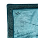 A close-up of two folded Splash Blanket The OG Waterproof Blankets in teal, crafted from plush micro-velvet with a soft, cozy texture and a small embroidered corner design. Perfect for comfort and style in a compact size.