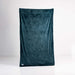 The Splash Blanket Furlush Luxurious Faux Fur Waterproof Blanket - Medium, in dark teal velvet, is displayed vertically against a plain white background, highlighting its plush texture.