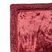 A close-up of the Splash Blanket The OG Waterproof Blanket - Large, a soft, reddish-burgundy pet blanket featuring a plush border and a small paw print cutout detail in the corner.