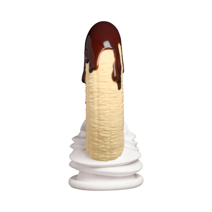 The Chocolate Dipped Banana Split Silicone Dildo with Suction Cup features a peeled banana design standing upright on whipped cream, drenched in chocolate sauce, and includes a suction base for stability against a white background.