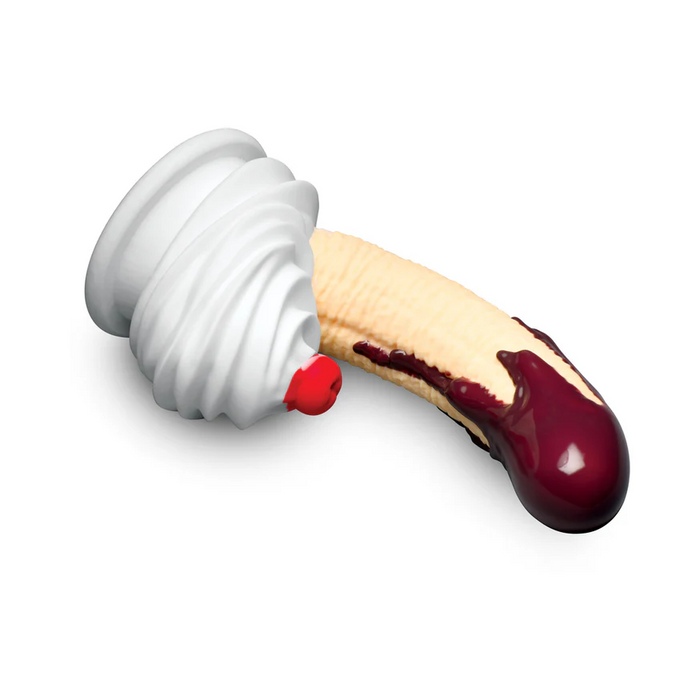 The Chocolate Dipped Banana Split Silicone Dildo with Suction Cup is a body-safe silicone toy shaped like a peeled banana, topped with whipped cream and a cherry, and dipped in chocolate sauce for a playful ice cream sundae look.