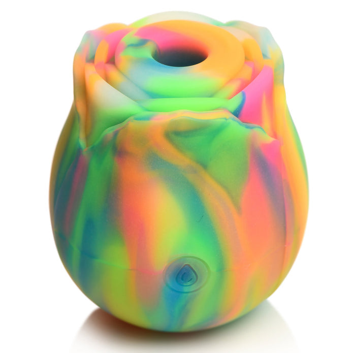 The Bloomgasm Glow Rose Glow-in-the-Dark Clitoral Stimulator is a rosebud-shaped silicone toy with swirling neon hues—green, yellow, orange, pink, and blue—and has a small round button at the base for easy control.