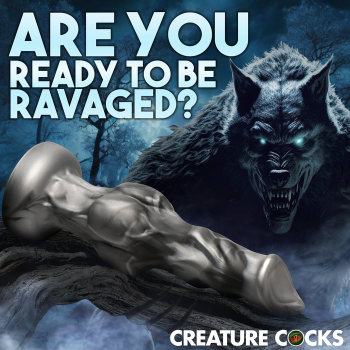 A fantasy-themed ad features a glowing-eyed werewolf in a dark forest with the Night Prowler 10 Inch Werewolf Canine Dildo with Knot in front. Bold text: "Are you ready to be ravaged?" Brand name “Creature Cocks” below.