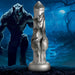 A detailed metallic fantasy sculpture stands upright, with a menacing werewolf and the Night Prowler 10 Inch Werewolf Canine Dildo with Knot amid barren trees and a full moon in a dark, eerie landscape.