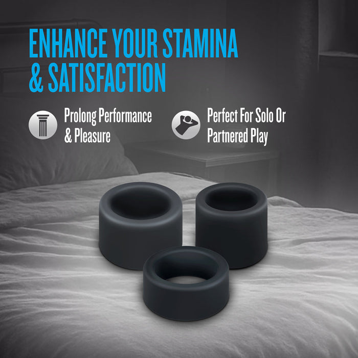 Three Accelerate Thick Stretchy Black Silicone Cock Rings lie on a bed, with text "Enhance Your Stamina & Satisfaction," and icons showing this set of 3 is body safe, boosts performance and pleasure, and suits solo or partnered play.