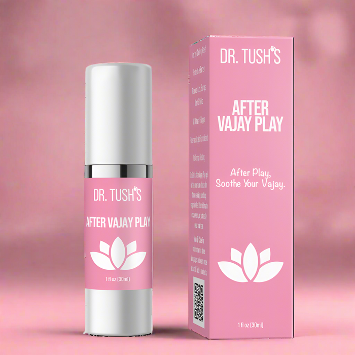A pink box and matching bottle labeled "After Vajay Play Soothing Lotion by Dr. Tush," featuring a white lotus on a pink background. This pH-balanced feminine lotion soothes and supports intimate skin recovery after play.