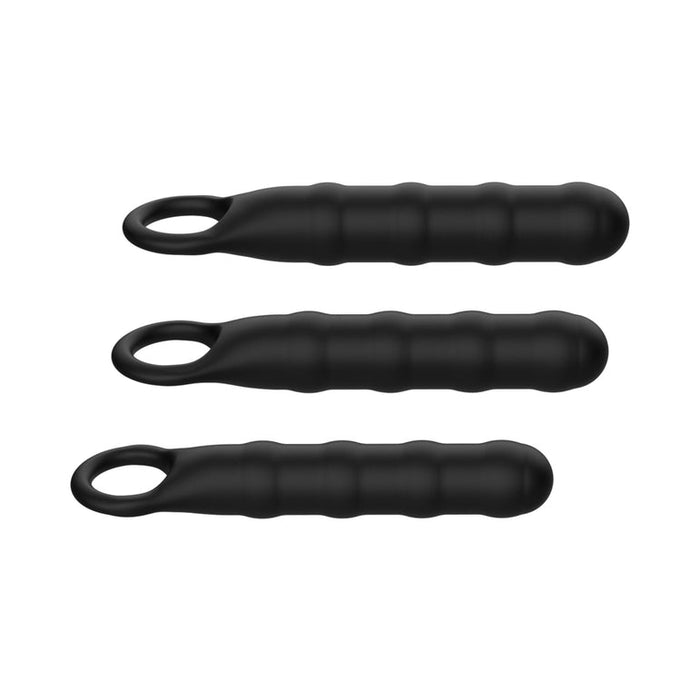 The Ass-Sation Silicone Anal Wand Training Kit features three black, ribbed silicone rods with rounded tips and looped handles in varying lengths—ideal for beginners looking to explore anal play.