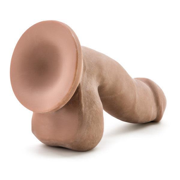 The Au Naturel 6.5 Inch Dual Density Suction Cup Dildo in Mocha by Blush is a realistic silicone dildo that features a suction cup base for hands-free use. Shaped to resemble a penis, it boasts detailed textures and contours for added realism and enhanced pleasure during use.