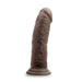 The Au Naturel Thick 8 Inch Realistic Feel Dual Density Dark Tone Suction Cup Dildo features a lifelike shape with veins and a pronounced head, sturdy suction cup base, dark chocolate color, and is harness compatible for versatile play.