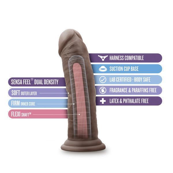 The Au Naturel Thick 8 Inch Realistic Feel Dual Density Dark Tone Suction Cup Dildo is shown featuring a soft outer layer, firm inner core, flexible shaft, harness compatibility, body-safe material, fragrance and latex-free formula.