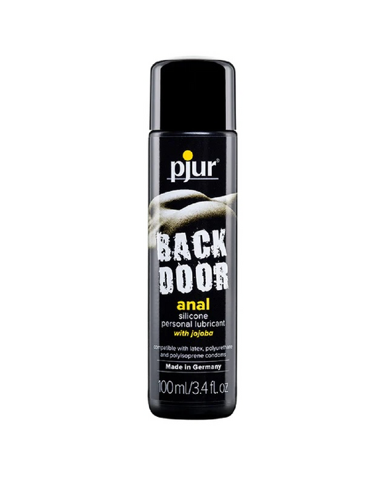 A sleek black bottle of Pjur Backdoor Glide Silicone Anal Lubricant - Various Sizes, an anal sex silicone lubricant enriched with jojoba. The label confirms compatibility with latex, polyurethane, and polyisoprene condoms. This 100ml/3.4 fl. oz. product proudly declares its German craftsmanship for a premium experience.
