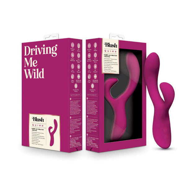The Quinn Warming G-Spot Rabbit Vibrator in purple features a curved design and is shown beside its packaging labeled "Driving Me Wild" and "Blush Quinn." Made of body-safe silicone, the toy is visible through a clear window on the box.