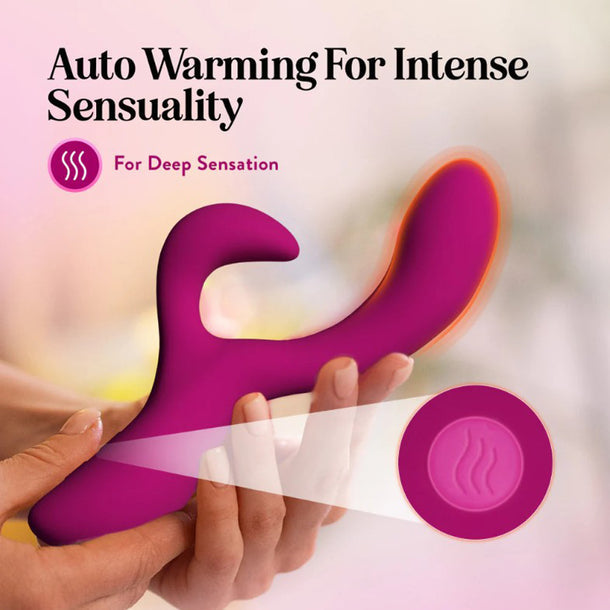 A close-up shows hands holding the Quinn Warming G-Spot Rabbit Vibrator, with one end glowing. Text reads “Auto Warming For Intense Sensuality” and “For Deep Sensation.” Made from body-safe silicone. A warming icon appears in the foreground.