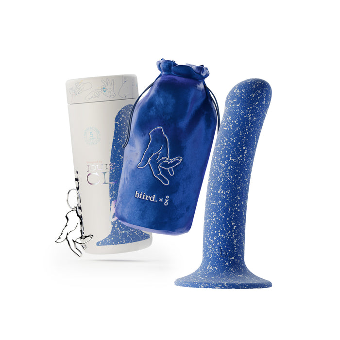 The Bae Slim Smooth 6 Inch Silicone Suction Cup Dildo in blue stands beside a white biird-branded box and a blue velvet pouch, featuring minimalist line art—perfect for strap-on compatibility or anal play.