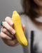 Banana Emojibator Vibrator held in woman's hand 