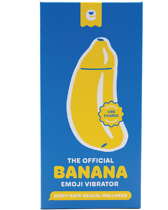 A bright blue Dame Products packaging featuring a yellow Banana Emojibator Vibrator, labeled "the official banana emoji vibrator" with icons indicating USB charging and body-safe silicone wellness.