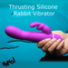 A hand holds the Bang Thrusting Silicone Rabbit Vibrator, a bright purple silicone toy, against a teal background. White text above says "Thrusting Silicone Rabbit Vibrator." "BANG!" is displayed in black at the bottom left.