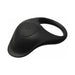 The Bang Beginner-Friendly Vibrating Silicone Cock Ring for Couples is a black, oval silicone ring with a large circular button and power symbol, designed for wearable clitoral stimulation and shared pleasure.