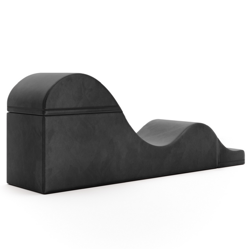 The Liberator Aria Flip Chaise Sex Lounger is a black, foam-covered ergonomic bench with a wave-like design, shown against a white background.
