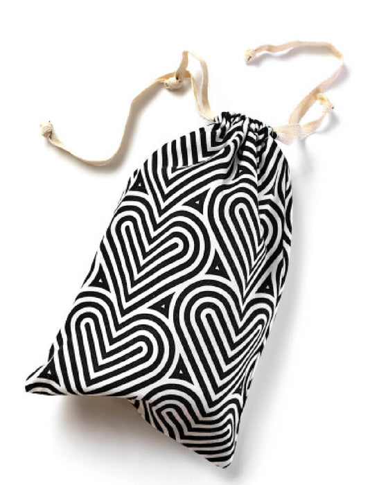 Blush Bomba Black & White Sex Toy Storage Bag laying on its side 