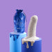 The Boo Thick Smooth 5.5 Inch Silicone Suction Cup Dildo, crafted from body-safe silicone with a cream-colored dripping glaze, is displayed alongside a blue drawstring pouch and a silver wire figure on blue pedestals against a purple background.