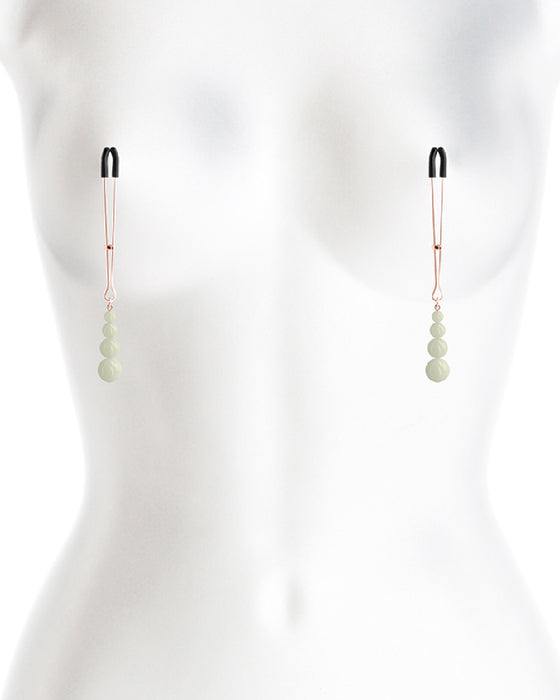 Bound Glow in the Dark Beaded Nipple Clamps on mannequin 