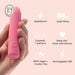 A hand holds the Ily Squishy Classic Silicone Bullet Vibrator—a pink, cylindrical toy featuring a splashproof design, quiet motor, 3 speeds, 7 patterns, body-safe silicone, 100% vegan and cruelty-free materials, and USB rechargeable convenience.