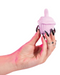 Cake Eater Clitoral Stimulator Tongue Vibrator - Pink in model's hand 