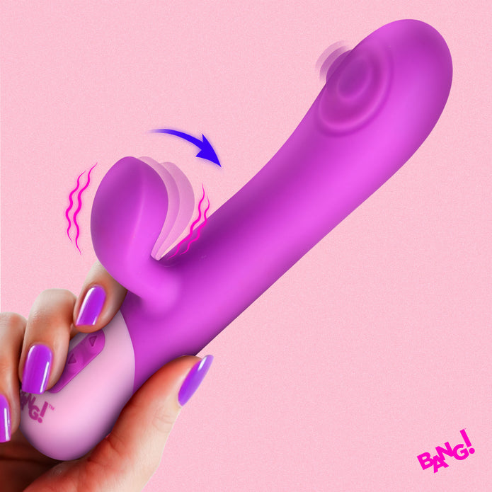 A hand with purple-painted nails holds the Clit Tapping G-Spot Pulsing Rabbit Flexible Silicone Vibrator against a pink background. Motion lines and an arrow highlight its clit-tapping and pulsing G-spot stimulation features. "BANG!" appears in the corner.