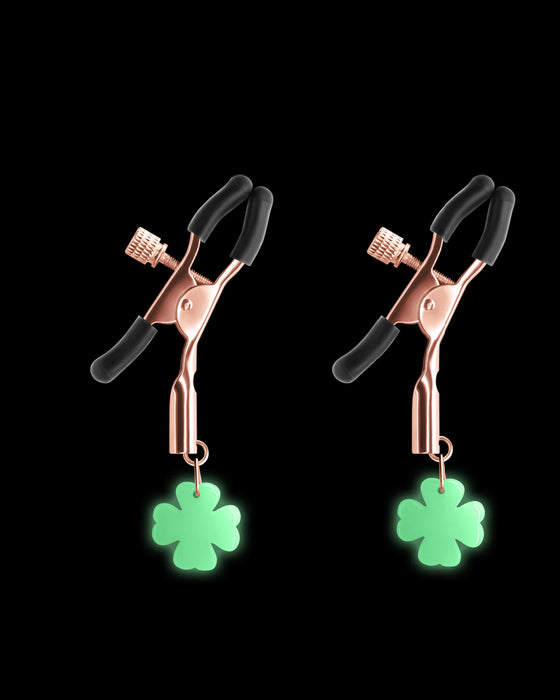 Glow in the Dark Clover Shaped Nipple Clamps on black background 